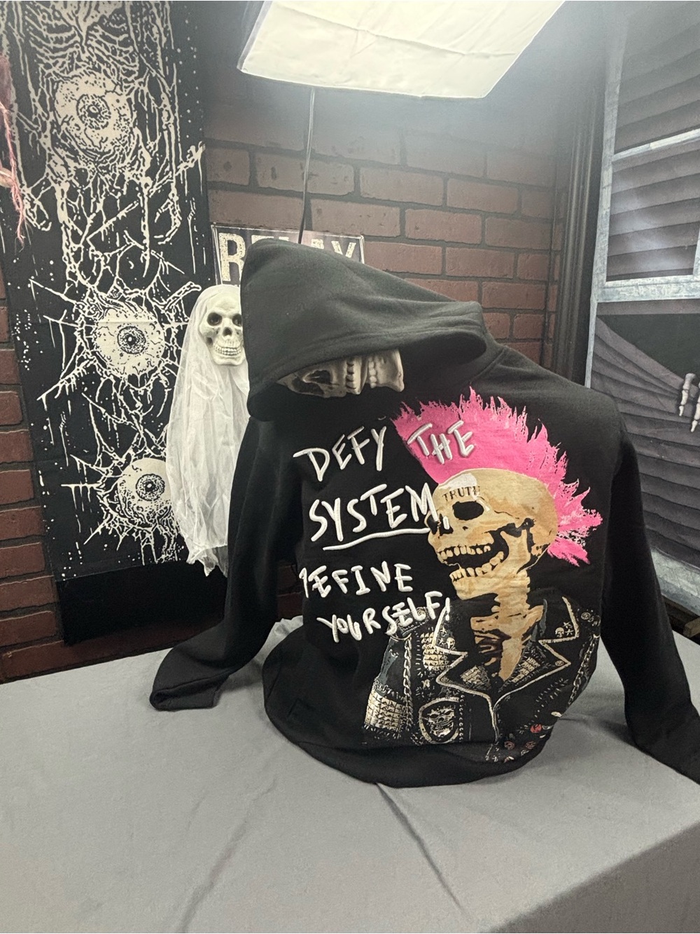 Reason Black Hoodie with Pink Mohawk Skull Graphic and White Text